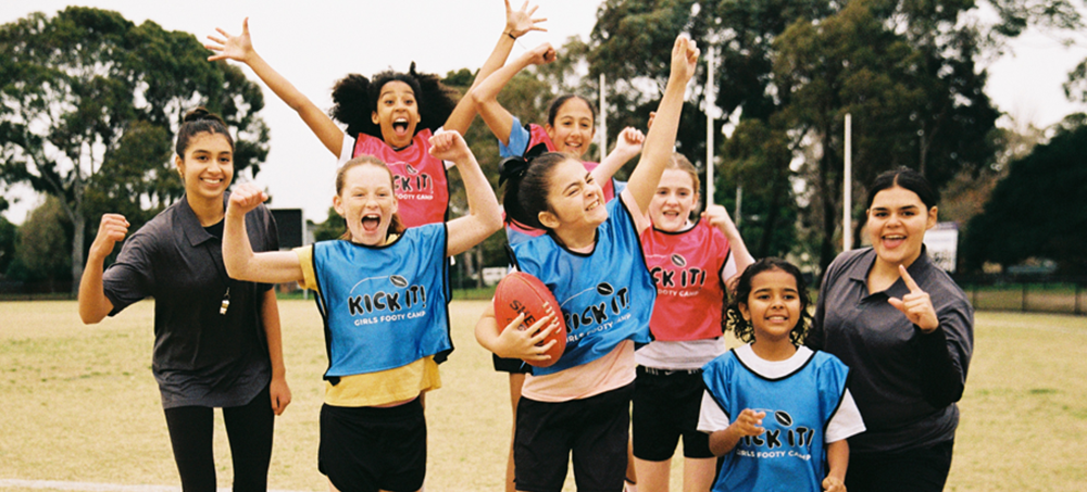 Volunteers coaching kids